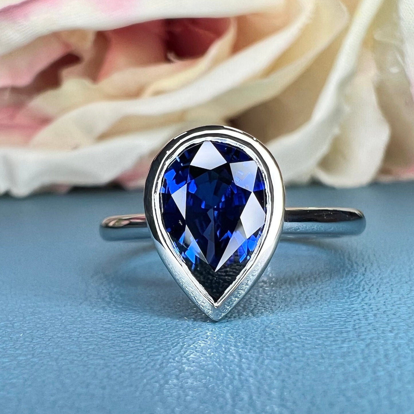 Pear shape blue sapphire ladies ring, bezel set in 14k white gold #5860