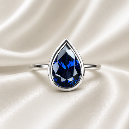 Pear shape  blue sapphire ladies ring, bezel set in 14k white gold #5860