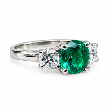 Emerald And Moissanite Round Three Stone Engagement Ring Set In 14K White Gold