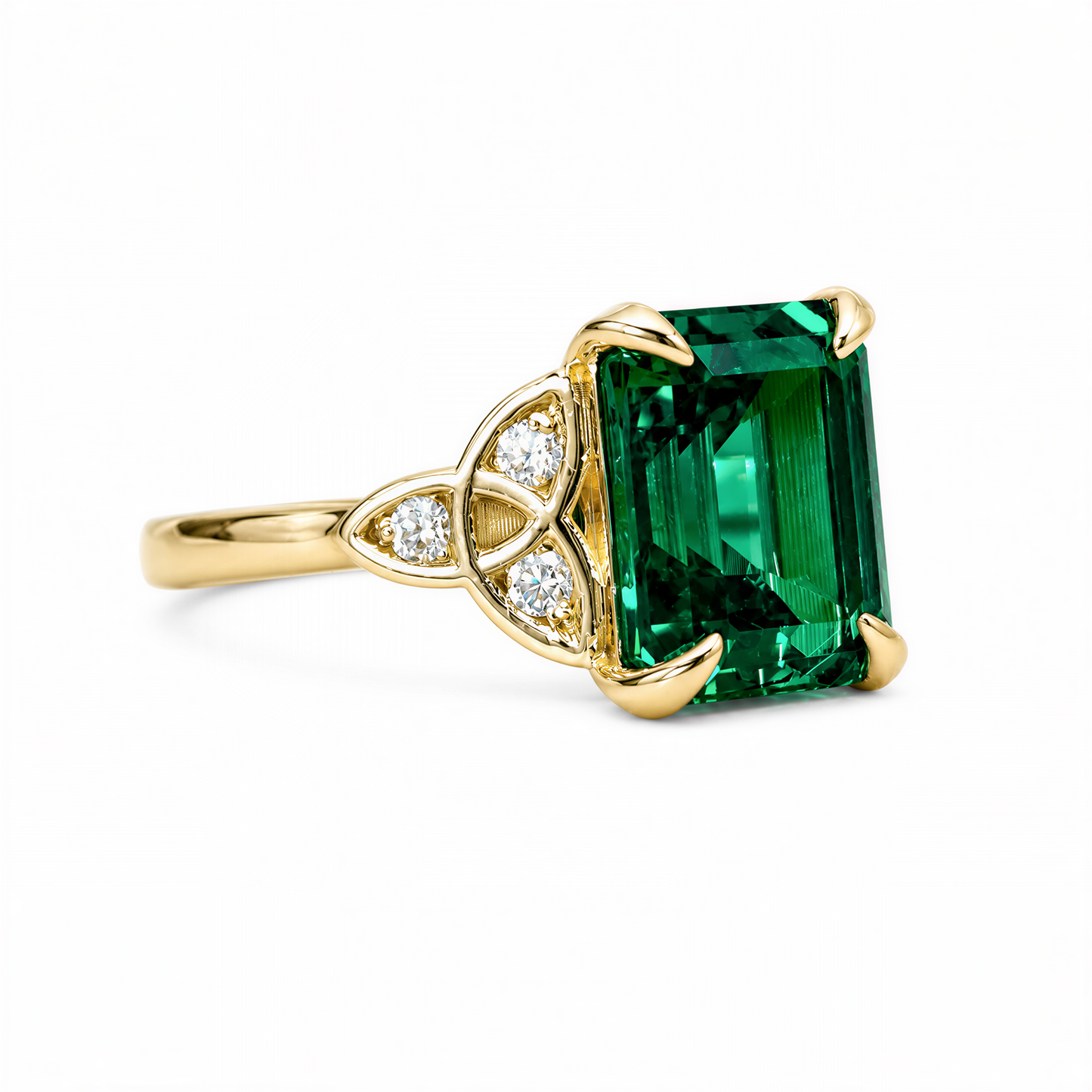 A gold ring with a large, green gemstone, possibly a diamond, set in the center.