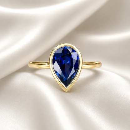 Pear shape  blue sapphire ladies ring, bezel set in 14k white gold #5860