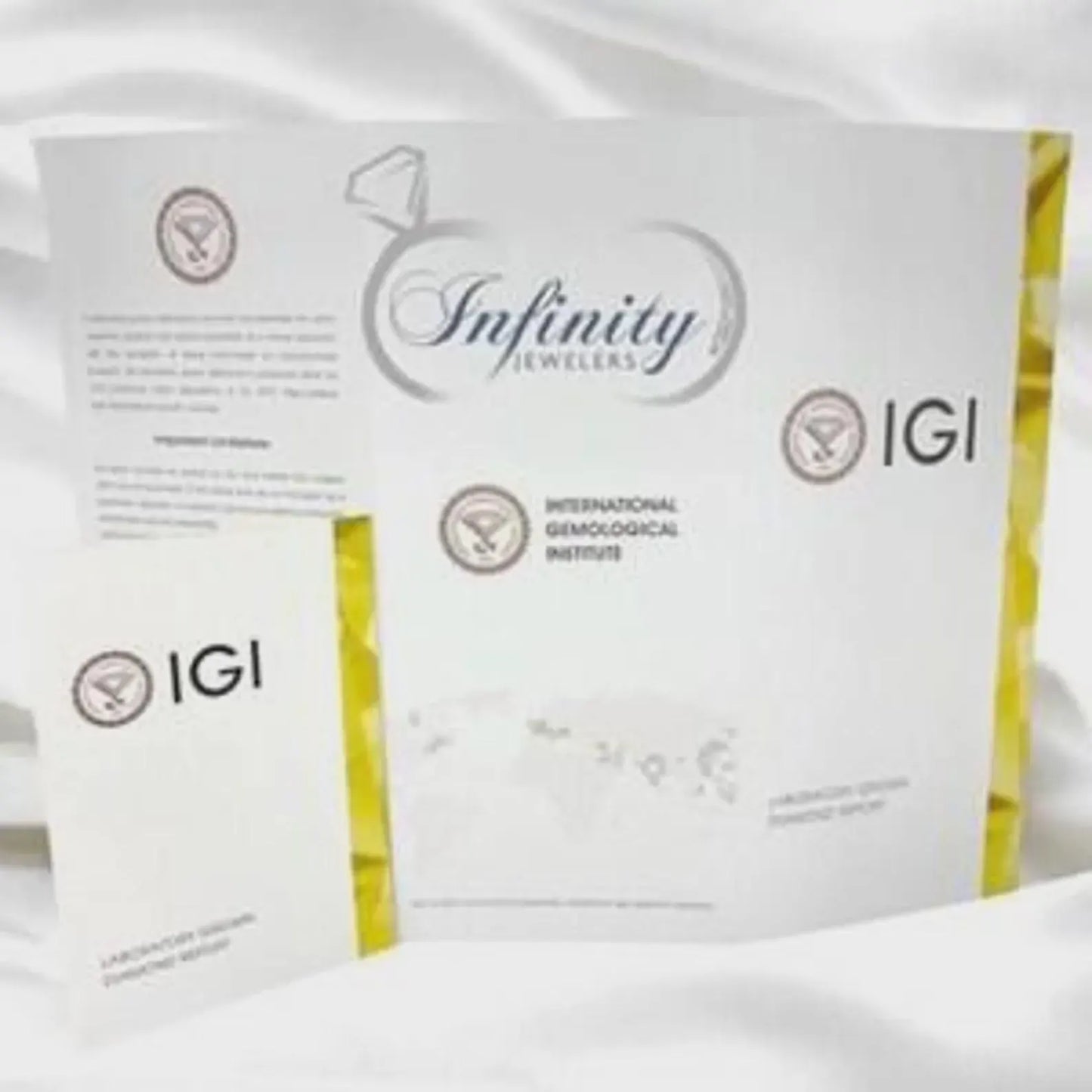 a set of documents related to the jewelry industry, including a brochure, a certificate, and a business card.