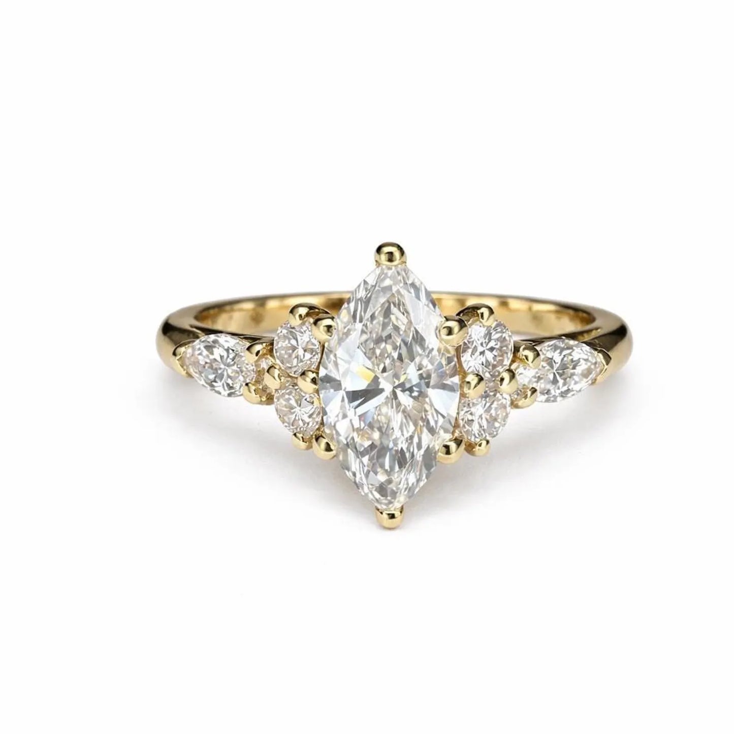 A gold engagement ring with a large central diamond surrounded by smaller diamonds on either side.