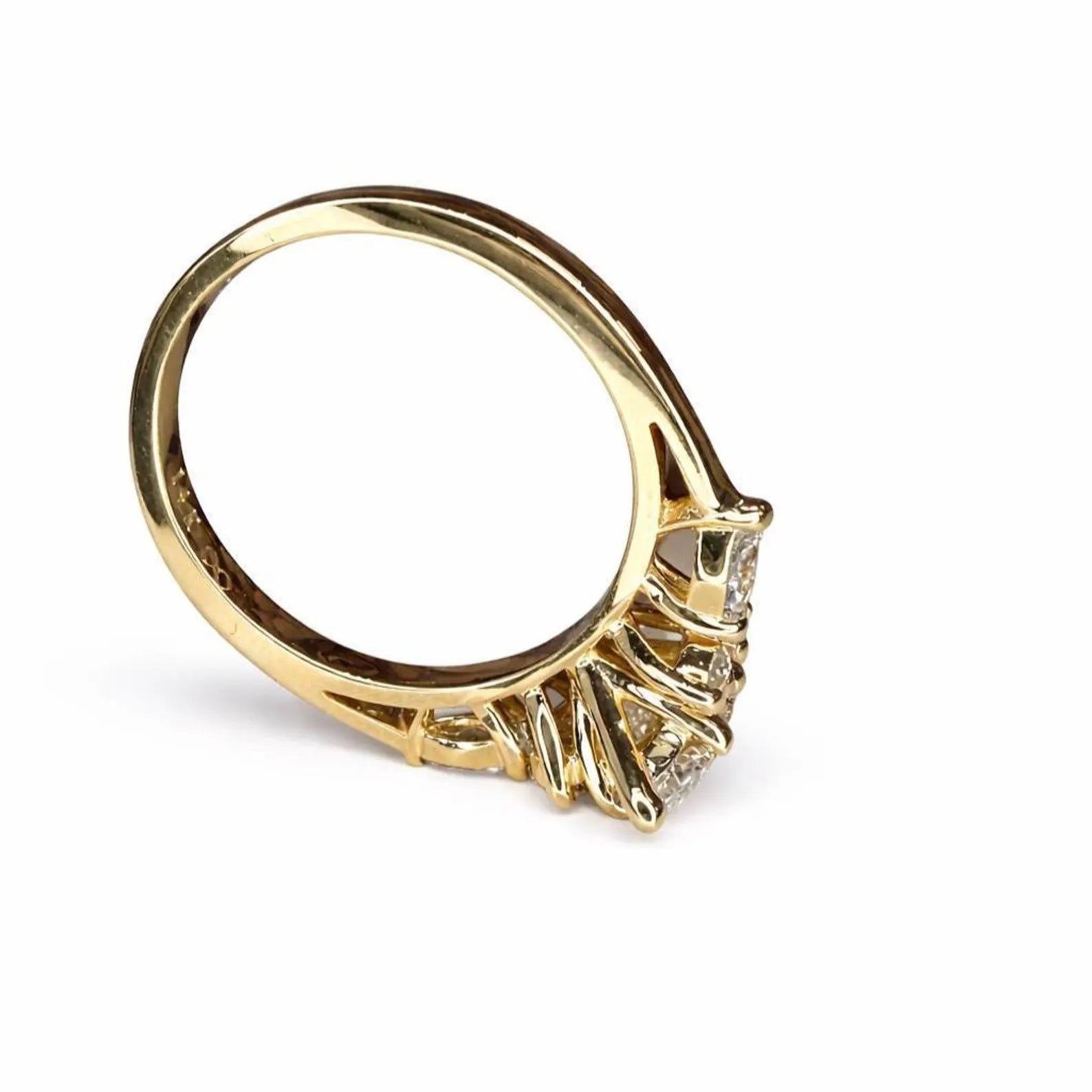 A gold ring with a diamond-encrusted band and a central diamond.