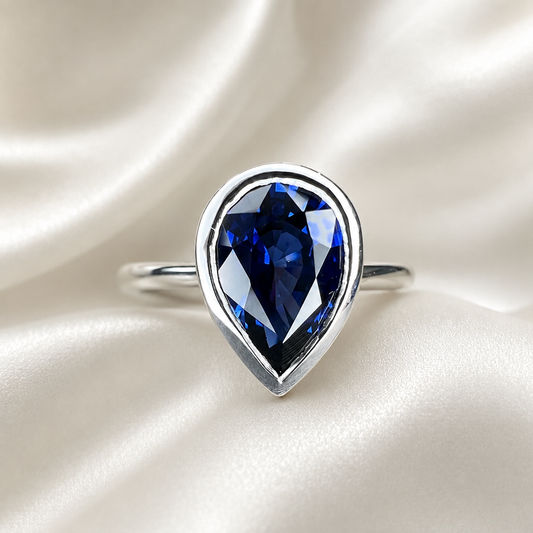 Pear shape  blue sapphire ladies ring, bezel set in 14k white gold #5860