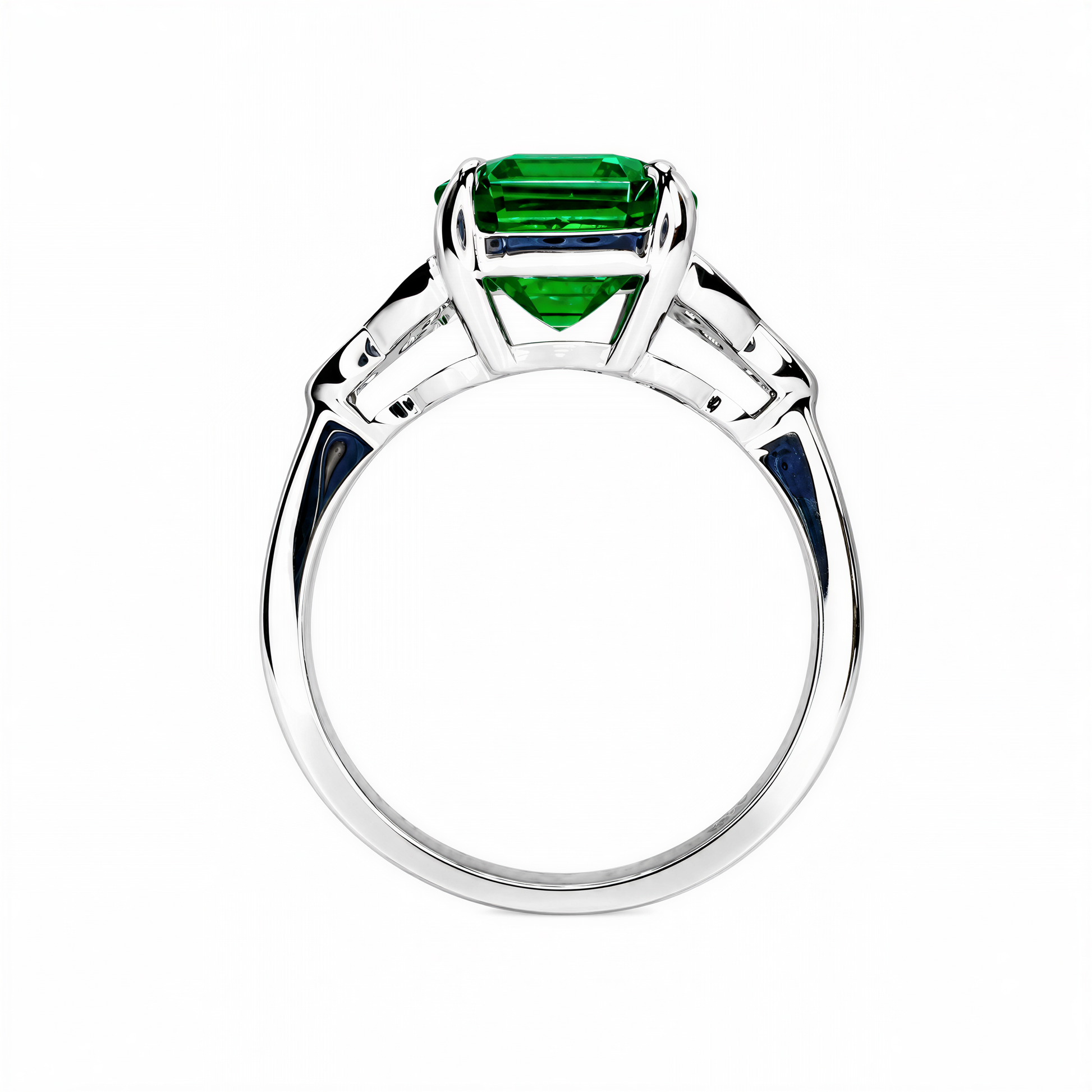 A silver ring with a large, green gemstone set in the center.