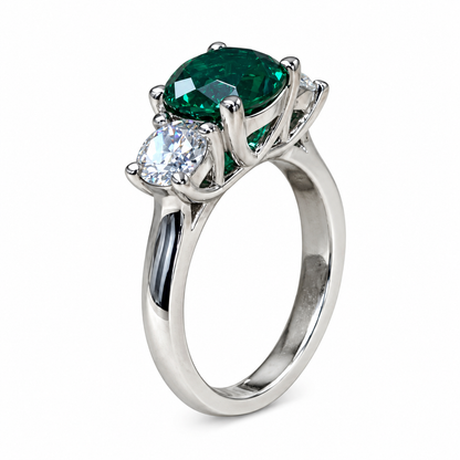 Emerald And Moissanite Round Three Stone Engagement Ring Set In 14K White Gold