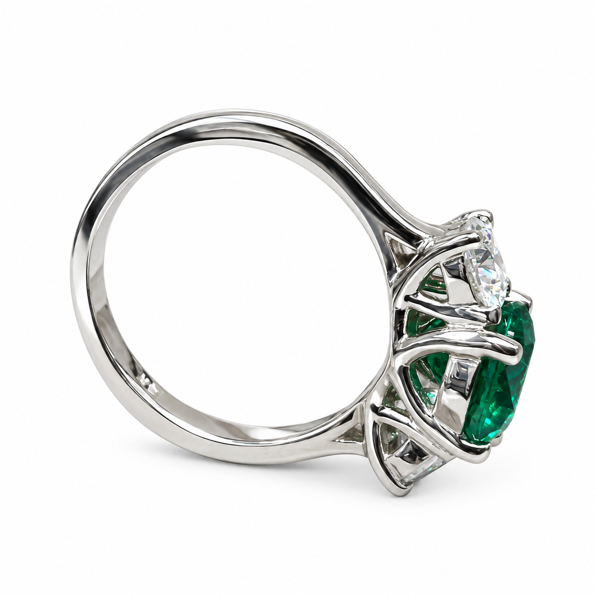 Emerald And Moissanite Round Three Stone Engagement Ring Set In 14K White Gold