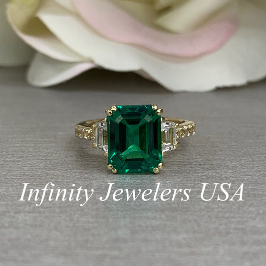 Emerald cut green emerald with trapezoid sides and round accents engagement ring, 4.50ctw, 14k yellow gold #6103