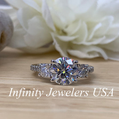 Certified Moissanite Three Stone Round Brilliant Cut Engagement Ring With Round Accents In 14K White Gold