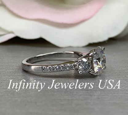 Certified Moissanite Three Stone Round Brilliant Cut Engagement Ring With Round Accents In 14K White Gold