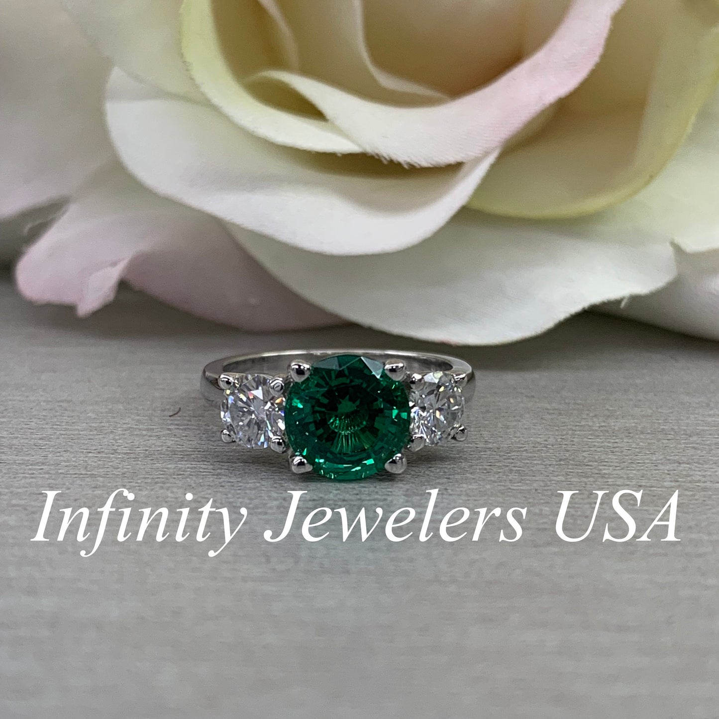 Emerald And Moissanite Round Three Stone Engagement Ring Set In 14K White Gold