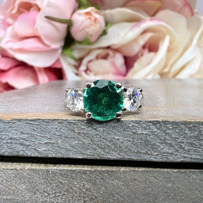 Emerald And Moissanite Round Three Stone Engagement Ring Set In 14K White Gold
