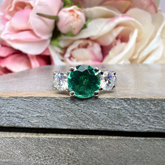 Emerald And Moissanite Round Three Stone Engagement Ring Set In 14K White Gold