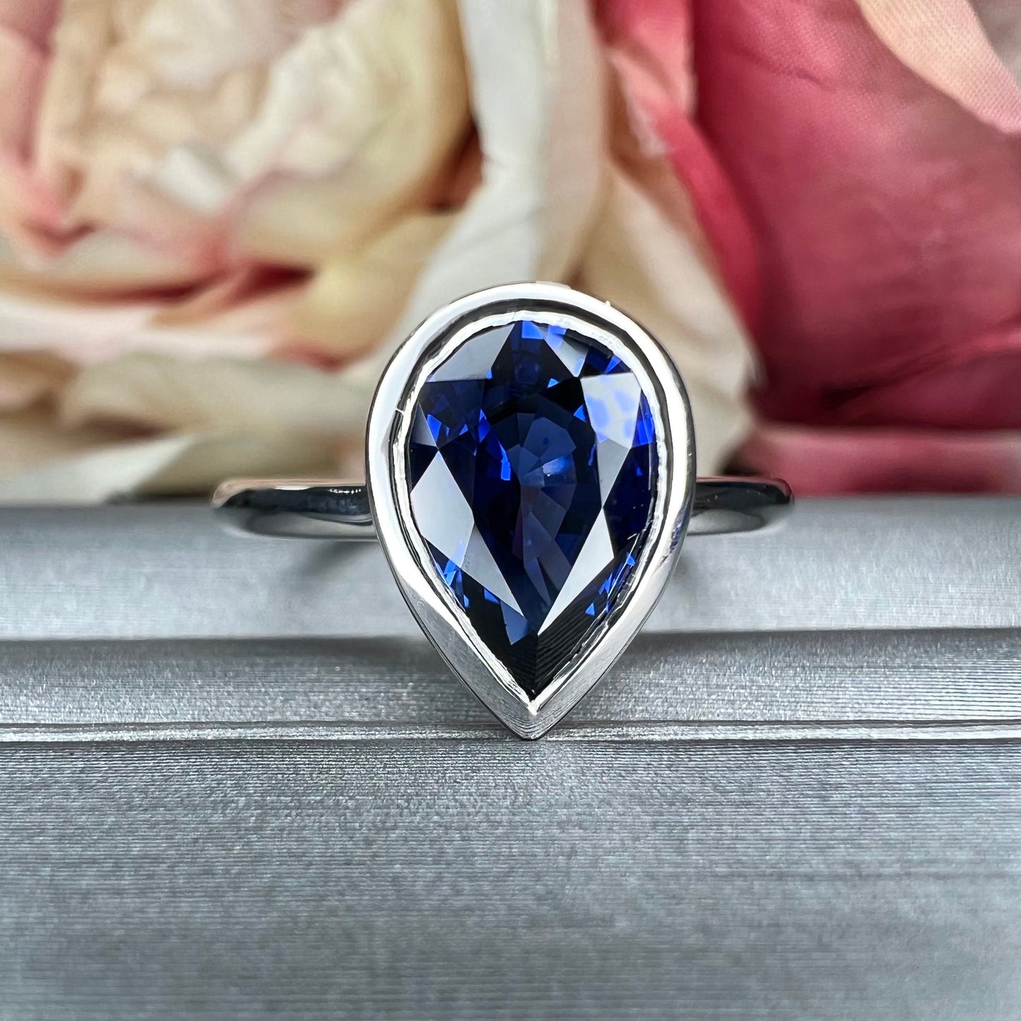 Pear shape  blue sapphire ladies ring, bezel set in 14k white gold #5860