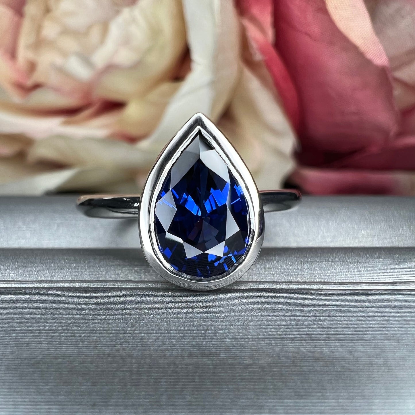 Pear shape  blue sapphire ladies ring, bezel set in 14k white gold #5860