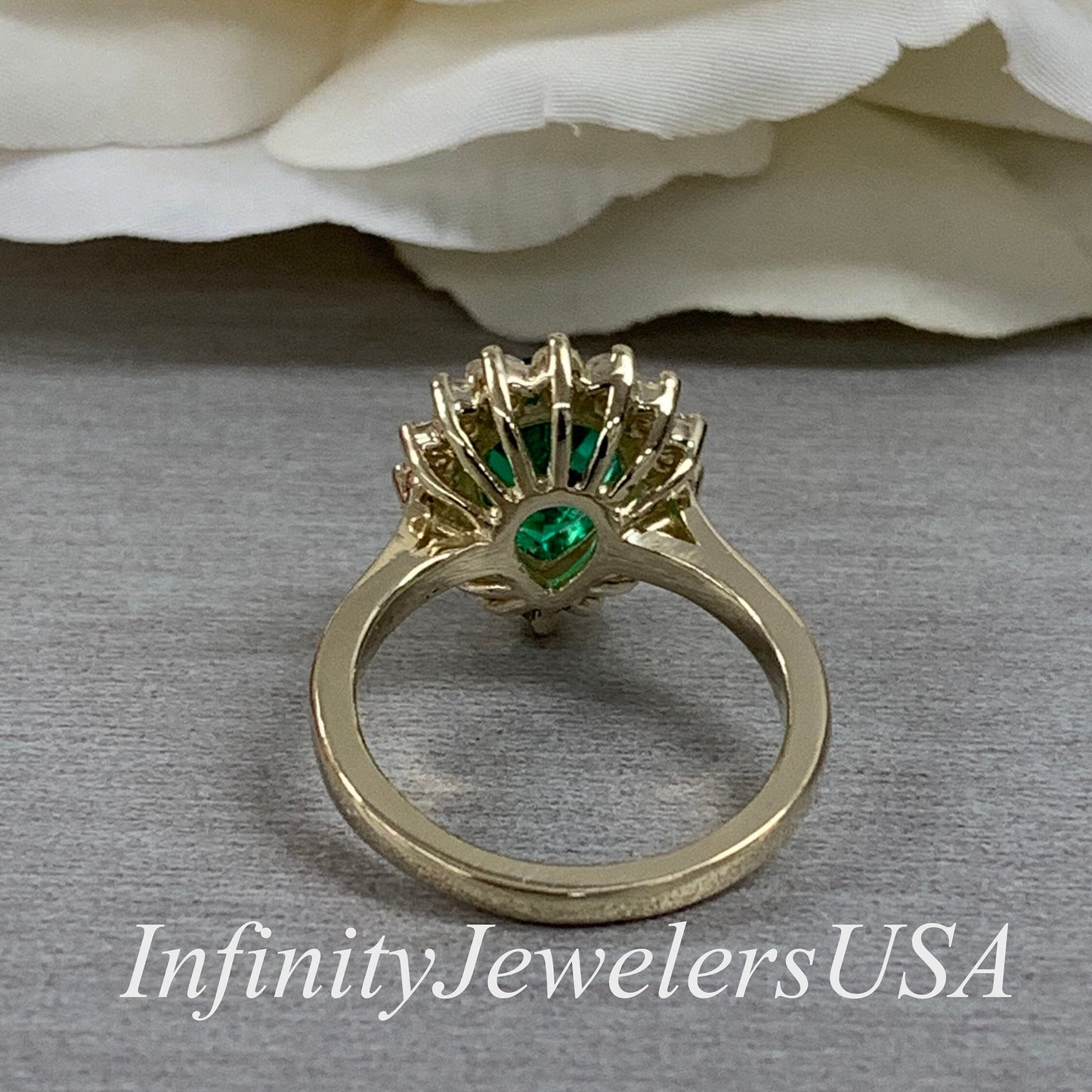 Pear Shape Green Emerald Engagement Ring With Round Moissanite Accents Made With Solid 14K Yellow Gold Item #6818