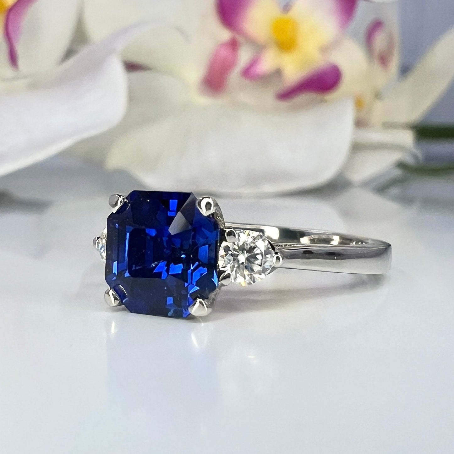 Blue sapphire asscher cut engagement ring, with round Moissanite 14k white gold
