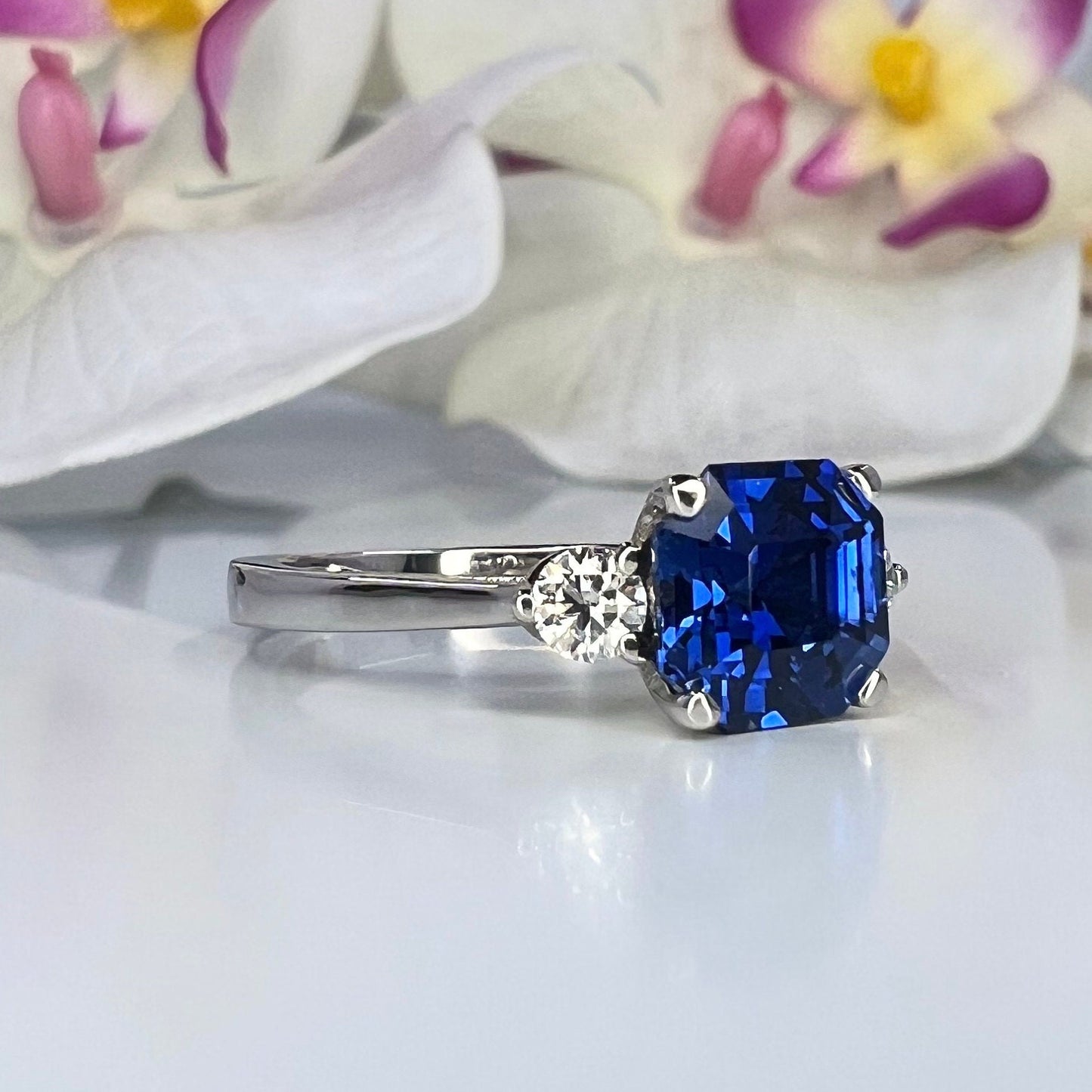 Blue sapphire asscher cut engagement ring, with round Moissanite 14k white gold