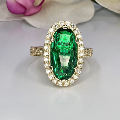 Elongated oval rose cut green emerald, diamond halo, engagement ring, 5.50ctw, 14k yellow gold